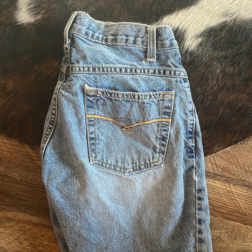 Cruel girl riding jeans